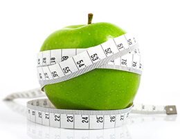 Zielone jabłko z miarką krawiecką – odchudzanie i dieta redukcyjna w Puławach